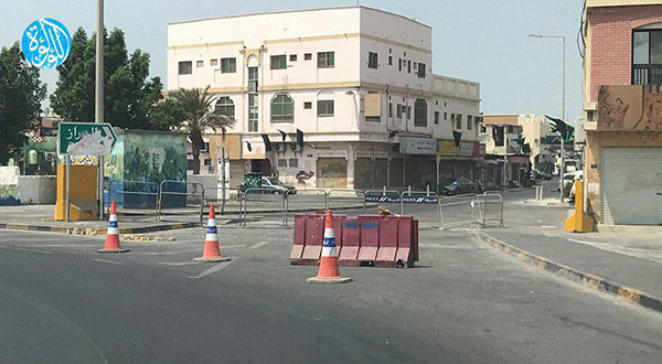 Concrete barricades and police checkpoints in Diraz